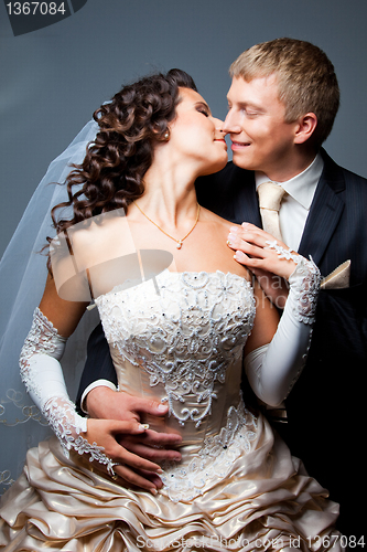 Image of kissing bride and groom