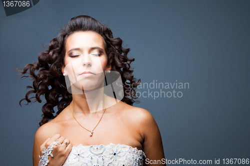 Image of attractive bride with long curly hair