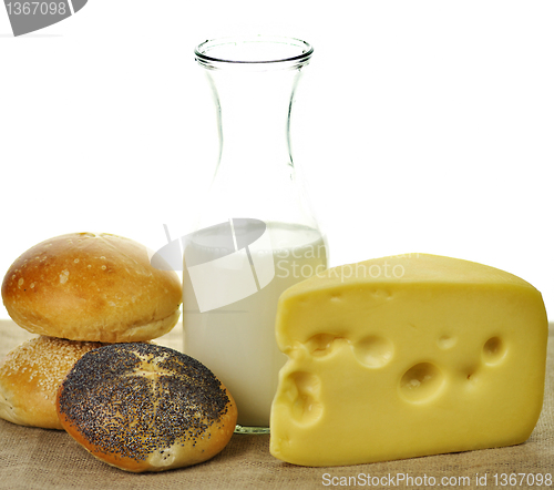 Image of milk bottle , cheese and fresh rolls