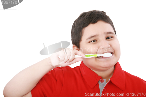 Image of Beautiful boy brushing teeth, isolated on white 