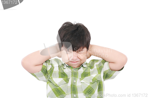 Image of Little boy closing his eyes and ears with his hands, isolated on