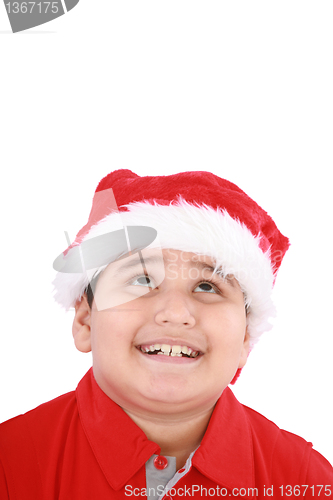 Image of Head shot of young beauty Santa boy looking up to copy space and