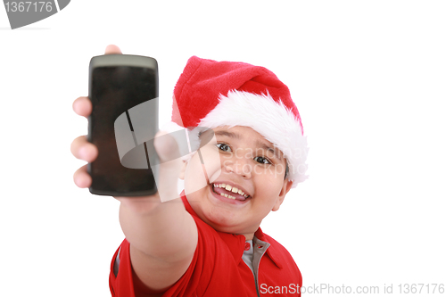Image of Little boy showing cell phone screen over white background. Boy 