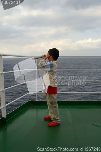 Image of A child boy on deck of cruise ship