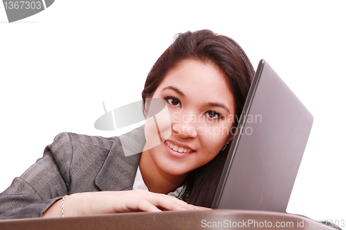 Image of Young business woman on a laptop - isolated on white 