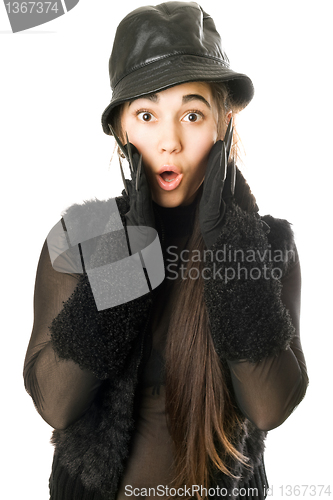 Image of Portrait of surprised girl in gloves with claws