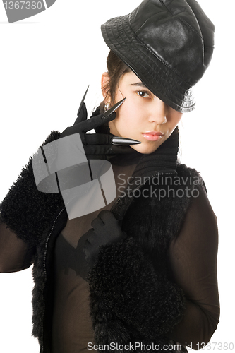 Image of Portrait of beautiful girl in gloves with claws