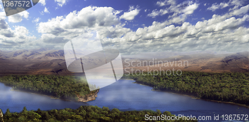 Image of Beautiful mountains landscape over a big lake 