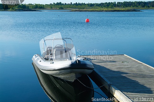 Image of Rigid inflatable boat at a pier