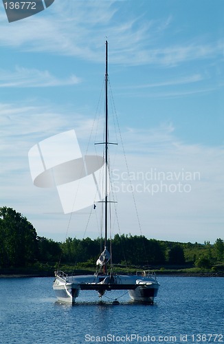 Image of Catamaran sailboat at anchor