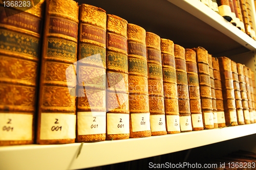 Image of old books in a library