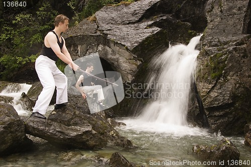 Image of Two man training at waterfalls