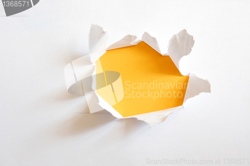 Image of yellow hole in paper