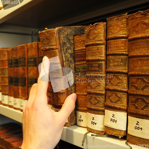 Image of old books in a library