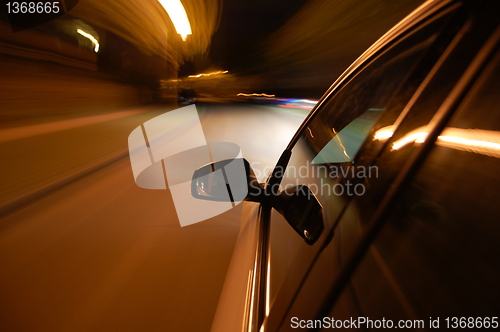 Image of night drive with car in motion 