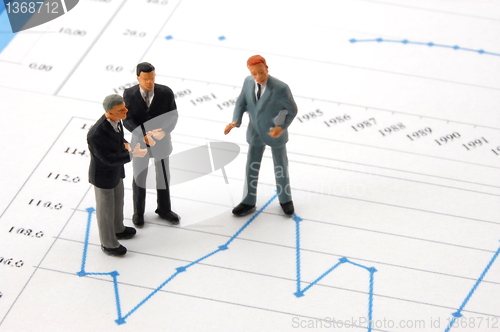 Image of business man over economic chart