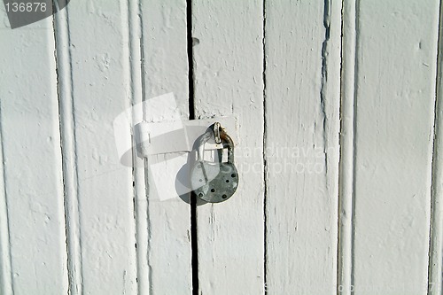 Image of Detail of old door with padlock