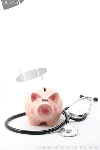 Image of stethoscope and piggy bank