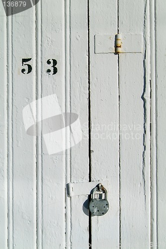 Image of Detail of wooden door with padlock