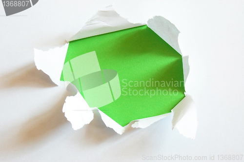 Image of green hole in blank sheet paper