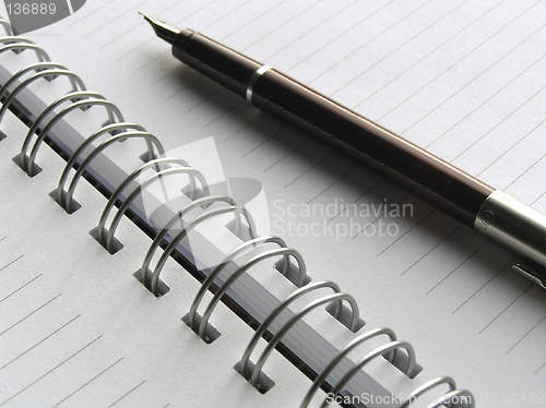 Image of White diary and pen