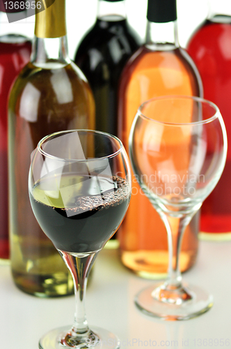 Image of assortment of wine bottles and glasses