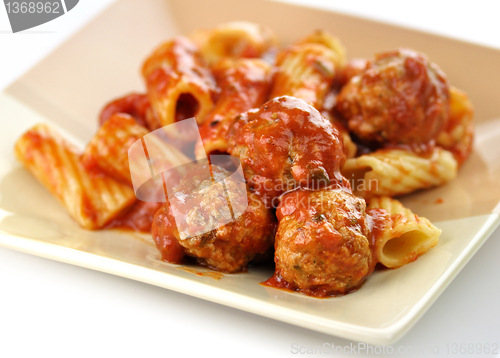 Image of Rigatoni with tomato sauce and meatballs. 