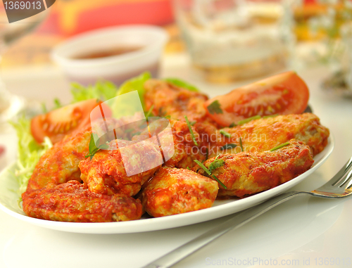 Image of hot chicken wings with salad