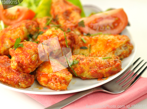 Image of hot chicken wings with salad