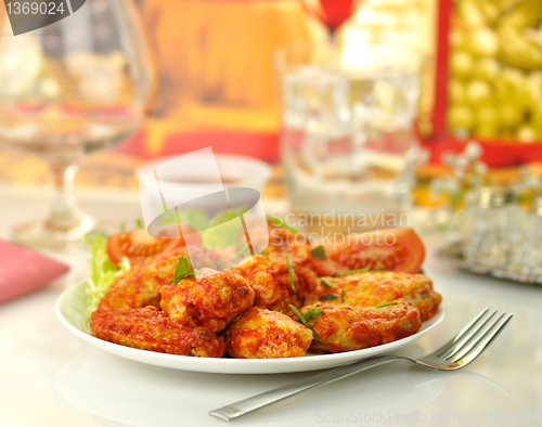 Image of hot chicken wings with salad