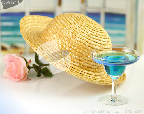 Image of straw hat and cocktail