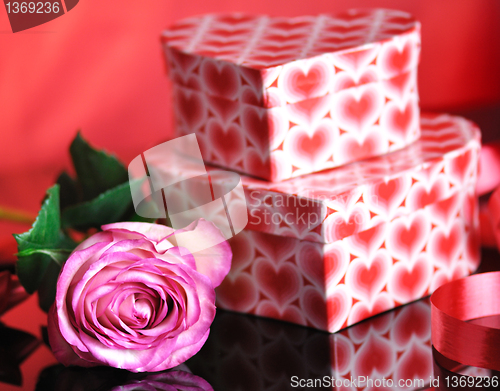 Image of pink rose and gift boxes