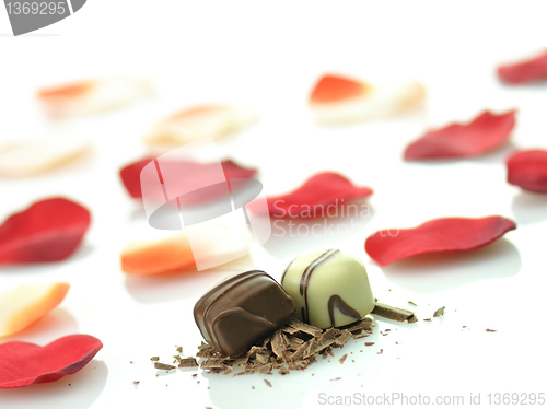 Image of chocolate candies and rose petals