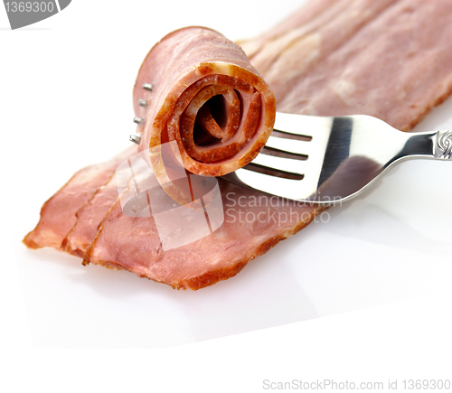 Image of turkey bacon with fork close up 