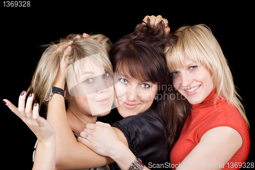 Image of Portrait of the three playful young women. Isolated