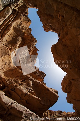 Image of Narrow slot between two rocks in desert canyon