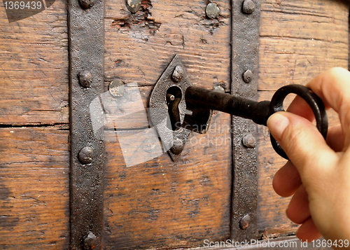 Image of hand with a key