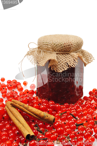 Image of Jar of homemade red currant jam with fresh fruits