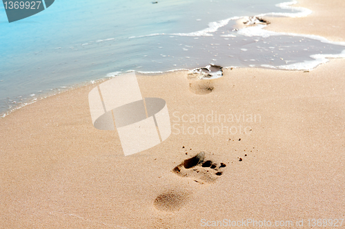 Image of footprints on sand beach