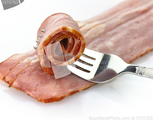 Image of turkey bacon with fork 