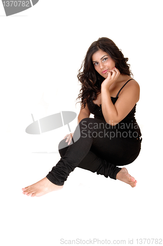 Image of Teenager girl sit on floor.