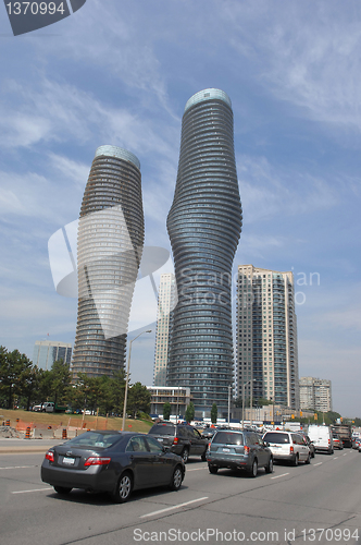 Image of Tow round high rise buildings.