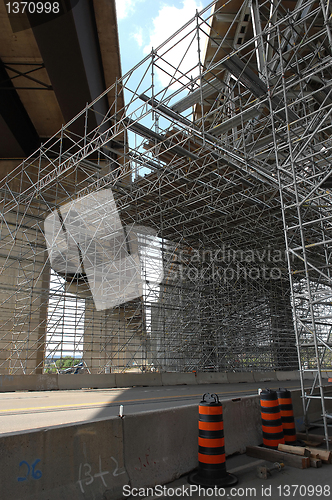 Image of Bridge repair with scaffolding.