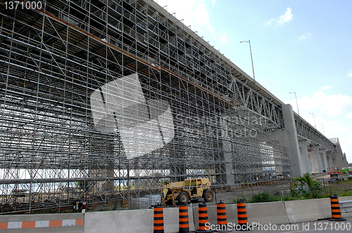 Image of Bridge repair with scaffolding.