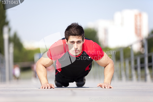 Image of Athlete man making pushups