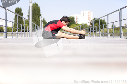 Image of Athlete warming and stretching