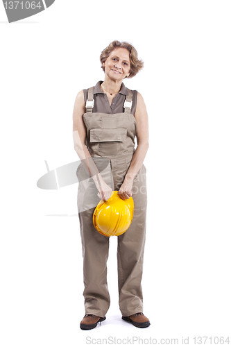 Image of Senior woman with a safety hat