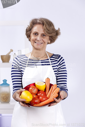 Image of Senior woman cooking