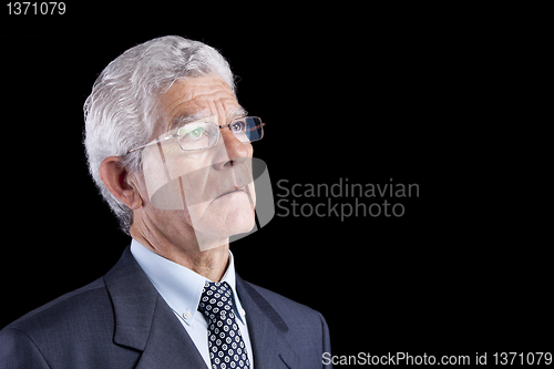 Image of Senior businessman looking up