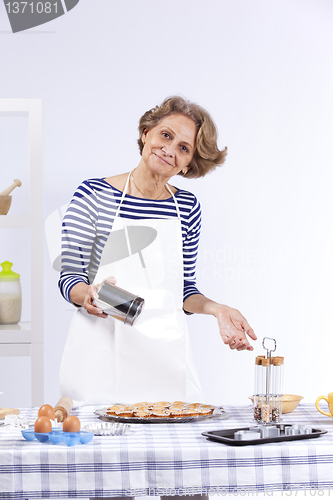 Image of Senior woman cooking